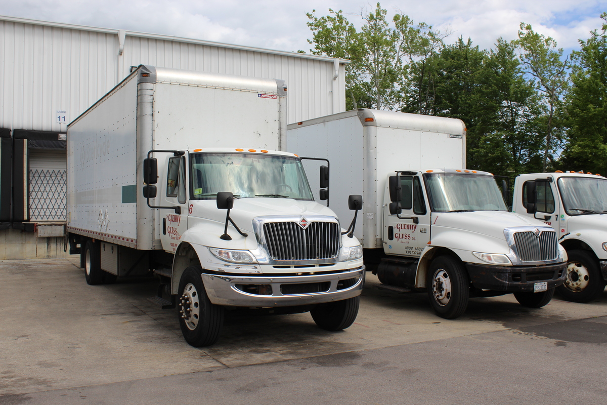 photo of fleet of 3 white box trucks